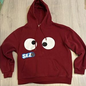 Burgundy Hoodie with googly eye graphic. Fleece inside.